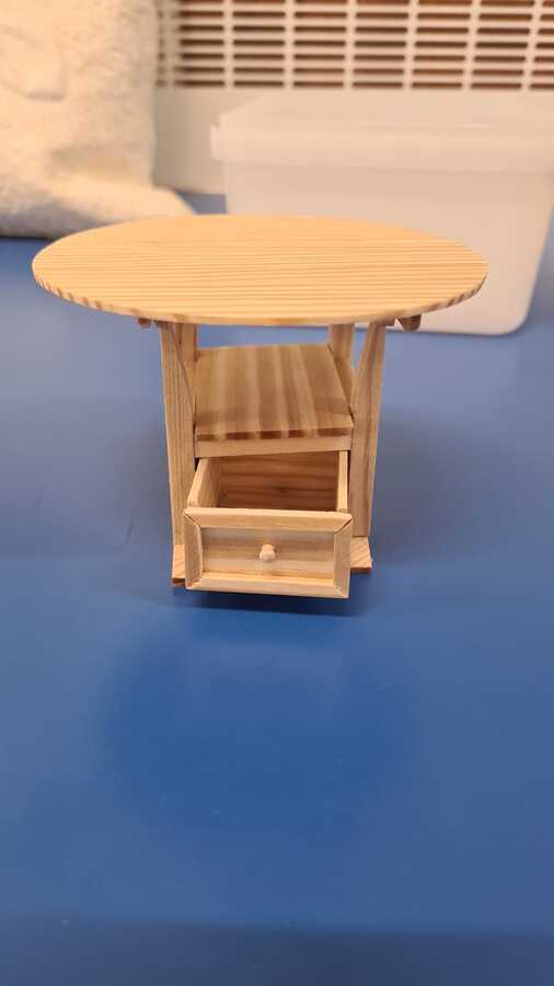 Kate has made a dolls house table that converts into a chair